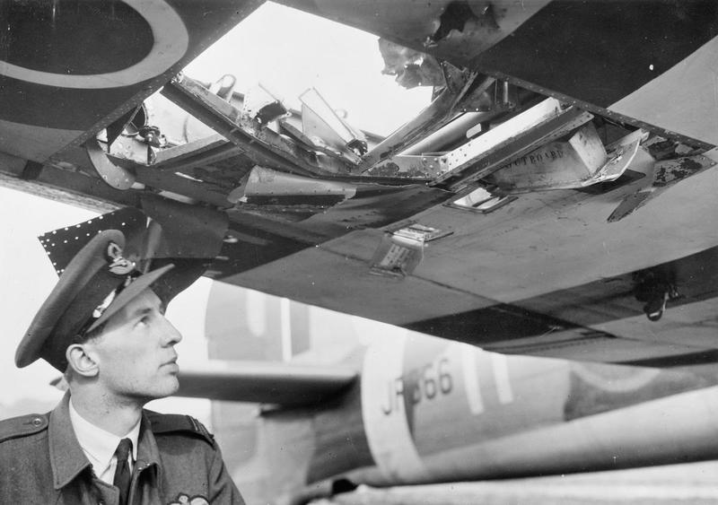 Squadron-Leader-J-M-Bryan-Commanding-Officer-of-No.-198-Squadron-RAF-inspects-the-damaged-starboard-wing-of-his-Hawker-Typhoon-Mark-IB-JR366-at-Manston-Kent.jpg